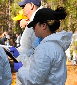 Sgt. Teela Antwine, Berkeley County Sherriff’s Office, sergeant of investigations, writes notes during a clandestine grave and human remains recovery training at Joint Base Charleston, S.C., Nov. 14, 2017.