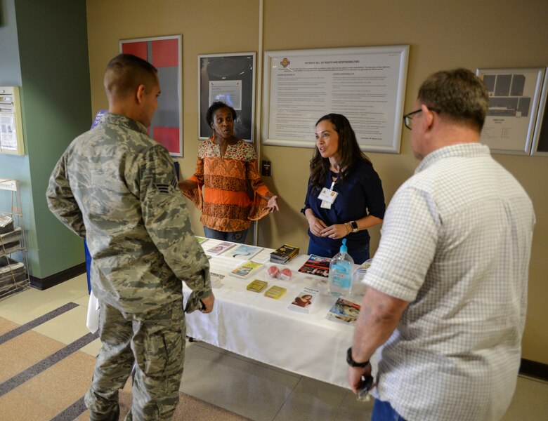 Decora Butler, 56th Medical Group environmental health technician, and Yyolany Caffrey, 56th Medical Group Health Promotions coordinator, answer questions and hand out educational materials about the Great American Smokeout at Luke Air Force Base, Ariz., Nov. 17, 2017. GASO takes place every year on the third Thursday of Novemeber and encourages smokers to quit, or begin to make a plan to quit, using tobacco products. (U.S. Air Force photo/Airman 1st Class Caleb Worpel)