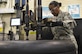 Chief Master Sgt. Shelina Frey, Air Mobility Command command chief, learns how to properly assemble a tire with the members of the 437th Maintenance Squadron Wheel and Tire shop in Joint Base Charleston, S.C., Nov. 17, 2017.