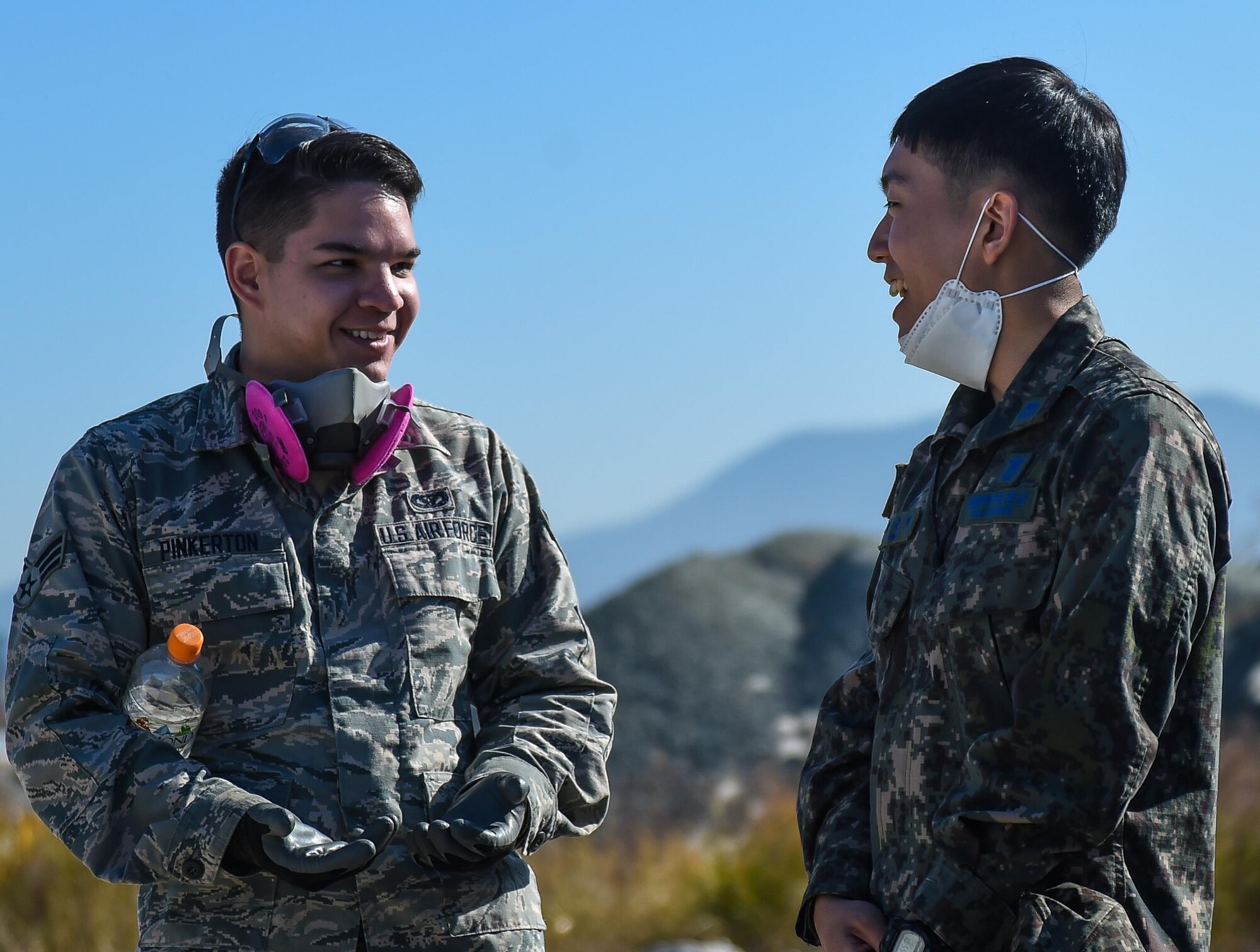 U.S. and Republic of Korea Airmen communicate during a Rapid Airfield Damage Repair bilateral training exercise at Gwangju Air Base, R.O.K., Nov. 9, 2017. U.S. and R.O.K. Airmen trained together for a week to learn the new RADR process, preparing them for response to wartime contingencies, enhancing interoperability and building partnership capacity in the Indo-Asia Pacific region. (U.S. Air Force photo by Senior Airman Curt Beach)
