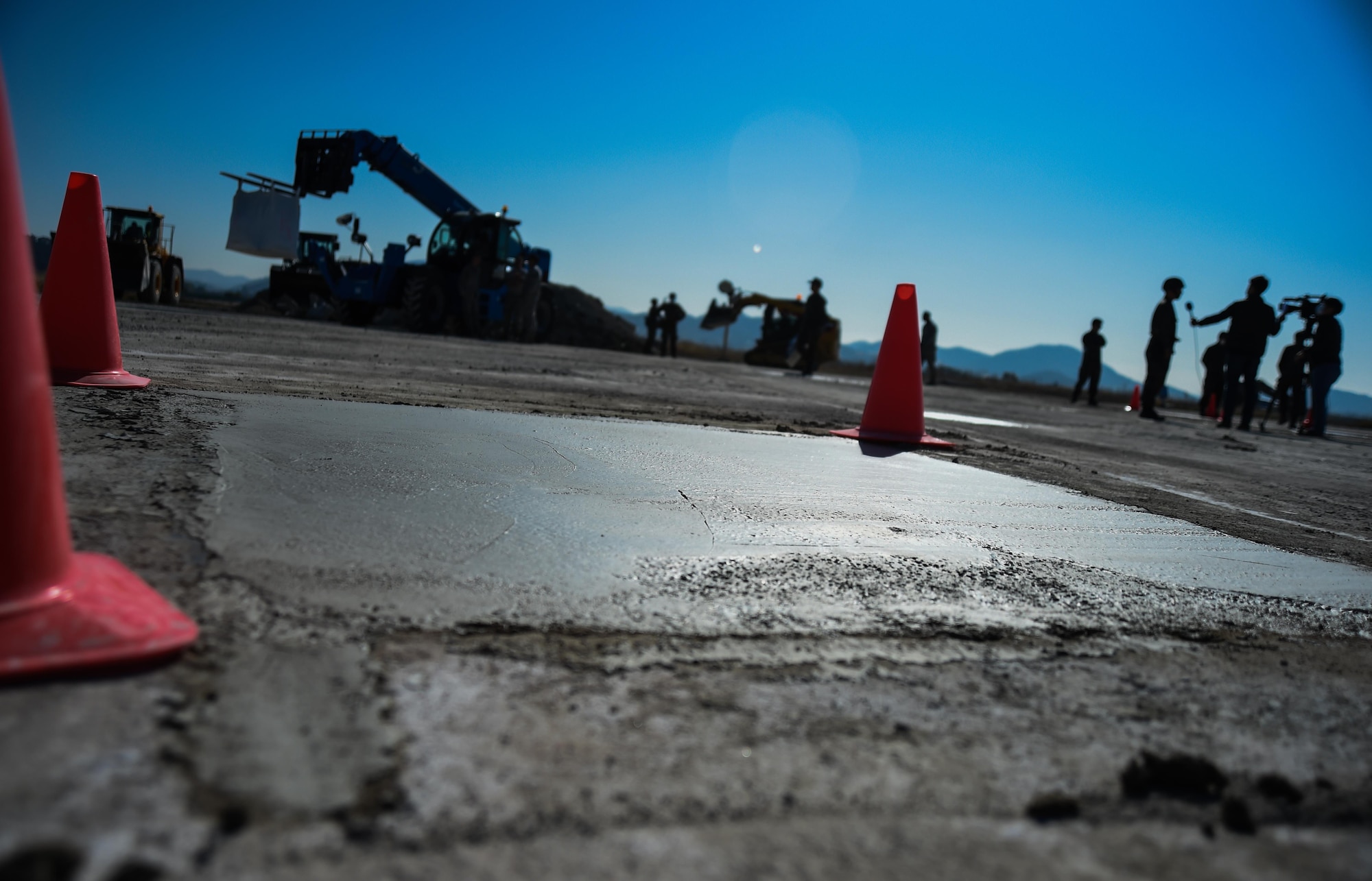 Freshly poured concrete cures on a mock airstrip during a Rapid Airfield Damage Repair bilateral training exercise at Gwangju Air Base, Republic of Korea, Nov. 9, 2017. Forty U.S. Airmen from the 773d Civil Engineer Squadron at Joint Base Elmendorf-Richardson, Alaska, and 40 R.O.K. Airmen trained together for a week to learn a new runway repair process for wartime contingencies. The bilateral training exercise enhanced interoperability and strengthen partnerships in the Indo-Asia Pacific region. (U.S. Air Force photo by Senior Airman Curt Beach)