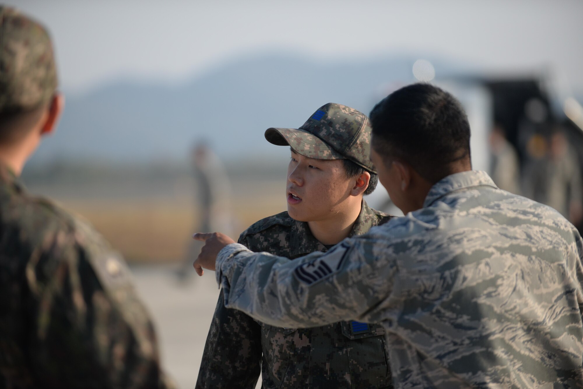 U.S. Air Force Master Sgt. Richard Loreto, Air Force Civil Engineer Center contingency instructor, explains a runway repair process to Republic of Korea Airmen during a bilateral training exercise at Gwangju Air Base, R.O.K., Nov. 6, 2017. Approximately forty U.S. Airmen from the 773d Civil Engineer Squadron at Joint Base Elmendorf-Richardson, Alaska, and 40 Republic of Korea Airmen from Gwangju trained together for a week to learn a new runway repair process for wartime contingencies. The bilateral training exercise enhanced interoperability and built partnership capacity in the Indo-Asia Pacific region. (U.S. Air Force photo by Senior Airman Curt Beach)