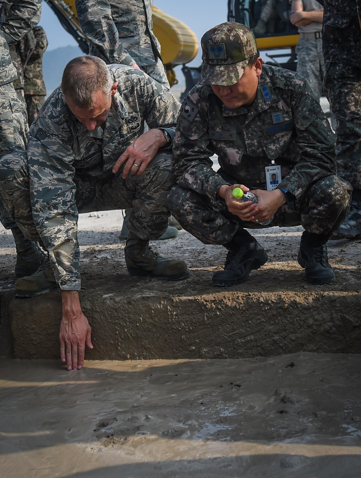 U.S. Air Force Col. Kevin Mantovani, 7th Air Force engineering division chief, and Republic of Korea Air Force Lt. Col. Injae Hwang, Air Force Operation and Command, observe a Rapid Airfield Damage Repair bilateral training exercise at Gwangju Air Base, R.O.K., Nov. 8, 2017. The training exercise was designed to enhance interoperability, prepare for wartime contingencies and build partnership capacity in the Indo-Asia Pacific region. (U.S. Air Force photo by Senior Airman Curt Beach)