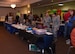90th Medical Group Airmen wait for patrons to come to the Warren Top 3 craft fair and health fair, to share their information on F.E. Warren Air Force Base Wyo., Nov. 17, 2017. The purpose of the Fair is to promote health, wellness and safety to not only the base but community beneficiaries. Squadrons from all across the wing and people from the community set up booths to help promote health, safety or sell their crafts. (U.S. Air Force photo by Airman 1st Braydon Williams)