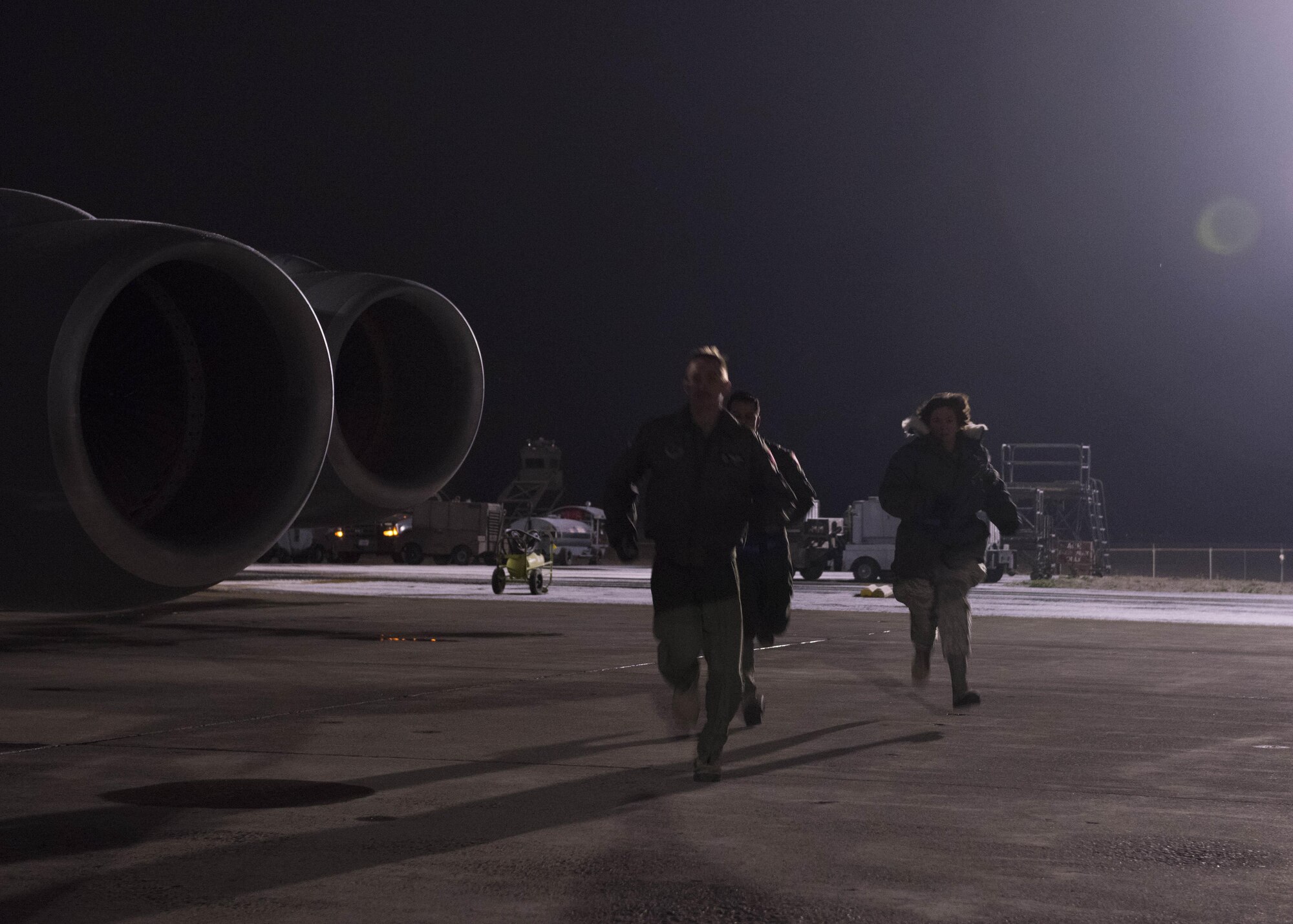 (From left to right) Senior Airman Timothy Diehl, KC-135 Stratotanker boom operator, Maj. Miguel Fernandez, KC-135 pilot, and Senior Airman Megan Myers, 141st Maintenance Group crew chief, respond to an alert call during Exercise Global Thunder 2018 at Fairchild Air Force Base, Washington, Nov. 4, 2017. Global Thunder is an annual U.S. Strategic Command (USSTRATCOM) exercise designed to provide training opportunities to test and validate command, control and operational procedures. The training is based on a notional scenario developed to drive execution of USSTRATCOM and component forces’ ability to support the geographic combatant commands, deter adversaries and, if necessary, employ forces as directed by the President of the United States. (U.S. Air Force photo/Senior Airman Ryan Lackey)