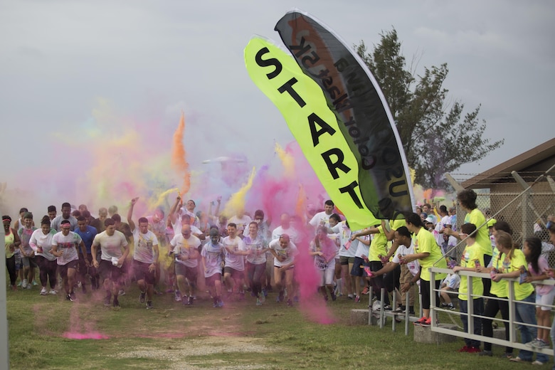 TORII STATION, OKINAWA, Japan – Participants of the 5th Annual USO Okinawa Color Blast 5K Fun Run are covered in a rainbow of colors as they take off Nov. 18 on Torii Station Beach, Okinawa, Japan.