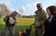 U.S. Air Force Chief Master Sgt. Jackie Harris, 24th Intelligence Squadron superintendent, left, loads a Thanksgiving package into a cart during an event sponsored by the United Services Organization on Vogelweh Military Complex, Germany, Nov. 18, 2017.  Senior enlisted leaders from multiple organizations in the Kaiserslautern Military Community teamed up with the USO to provide military members, pay grade E-5 and below, with Thanksgiving meals. (U.S. Air Force photo by Airman 1st Class Joshua Magbanua)