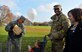 U.S. Air Force Chief Master Sgt. Jackie Harris, 24th Intelligence Squadron superintendent, left, loads a Thanksgiving package into a cart during an event sponsored by the United Services Organization on Vogelweh Military Complex, Germany, Nov. 18, 2017.  Senior enlisted leaders from multiple organizations in the Kaiserslautern Military Community teamed up with the USO to provide military members, pay grade E-5 and below, with Thanksgiving meals. (U.S. Air Force photo by Airman 1st Class Joshua Magbanua)