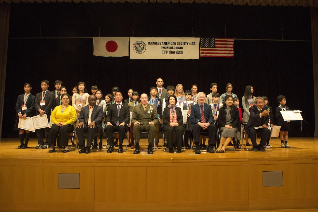 Contestants, judges and distinguished guests pose for a picture during the 56th Annual Japanese and English Speech Contest at Sinfonia Iwakuni Concert Hall in Iwakuni City, Japan, Nov. 19, 2017.  The contest was hosted by the Japanese American Society to help contestants understand and appreciate each other’s language and culture, strengthening the Japanese and American friendship.