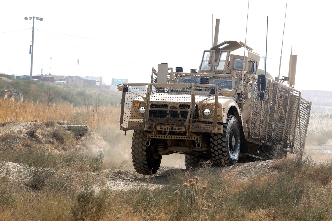 An Oshkosh Defense mine-resistant, ambush-protected all-terrain vehicle bumps across ruts during the off-road portion of the master driver training course at Bagram Airfield, Afghanistan, Nov. 8, 2017. Army photo by Spc. Elizabeth White