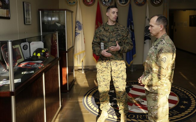 FORT EUSTIS, Va. – Marine Staff Sgt. Steve Cushamn, Public Affairs noncommissioned officer in charge, Joint Task Force Civil Support speaks with Army Command Sergeant Major, Ronald Orosz, senior enlisted leader, Army North inside Mullan Hall during a distinguished visitor event Jan 13, 2016. JTF-CS anticipates, plans and prepares for chemical, biological, radiological and nuclear response operations. (Official DOD photo by Navy Petty Officer 2nd Class Benjamin T. Liston)