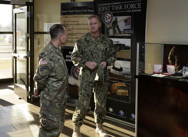 FORT EUSTIS, Va. –Navy Command Master Chief Jeffrey Covington, senior enlisted leader, Joint Task Force Civil Support speaks with Army Command Sergeant Major, Ronald Orosz, senior enlisted leader, Army North inside Mullan Hall during a distinguished visitor event Jan 13, 2016. JTF-CS anticipates, plans and prepares for chemical, biological, radiological and nuclear response operations. (Official DOD photo by Navy Petty Officer 2nd Class Benjamin T. Liston)