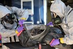 Decontamination team members of the Idaho National Guard’s 101st Civil Support Team practiced a new personnel decontamination procedure called the wipe-spray-wipe method during a hazardous incident exercise on Gowen Field, Oct. 26.