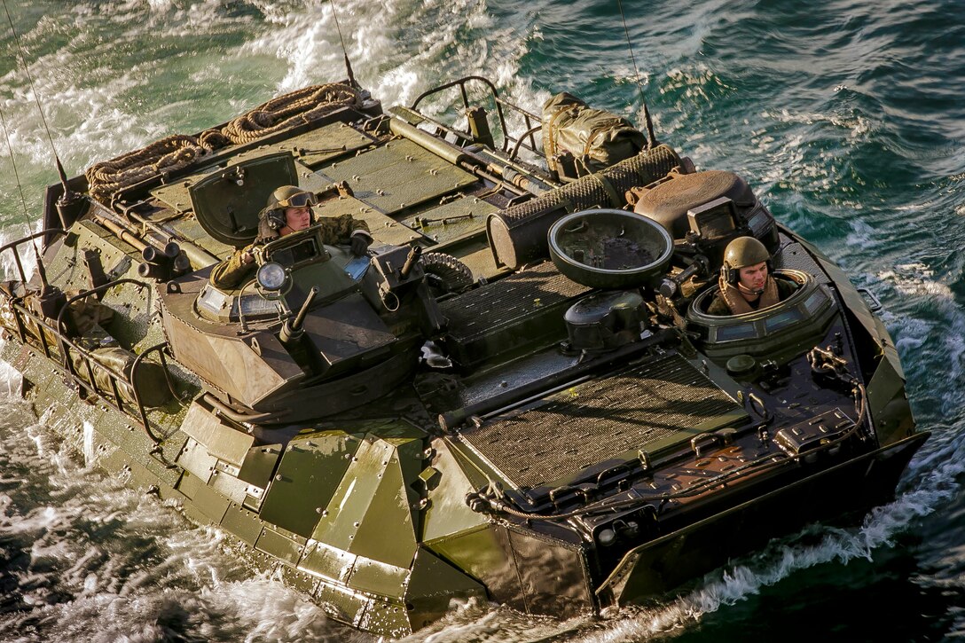 A U.S. Marine Corps AAV-P7/A1 assault amphibious vehicle (AAV) with the AAV Platoon, Fox Company, Battalion Landing Team, 2nd Battalion, 6th Marine Regiment, 26th Marine Expeditionary Unit (MEU), is driven iinto the dock landing ship USS Oak Hill (LSD 51) during a transition of the AAVs from shore to ship near Onslow Beach, N.C., Nov. 17, 2017, as part of Combined Composite Training Unit Exercise ( COMPTUEX). Combined COMPTUEX serves as the capstone event for the Amphibious Ready Group-MEU team prior to a deployment, fully integrating the ARG-MEU team as an amphibious force and testing their ability to execute missions across a range of military operations. (U.S. Marine Corps photo by Staff Sgt. Dengrier M. Baez)