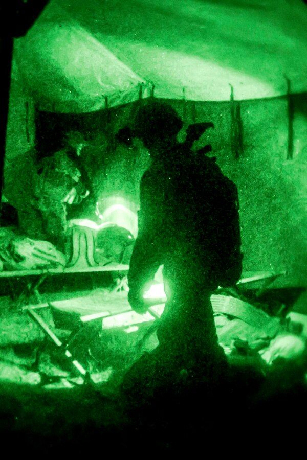 U.S. Marines with Fox Company, Battalion Landing Team, 2nd Battalion, 6th Marine Regiment, 26th Marine Expeditionary Unit (MEU), search a tent during a night mechanized raid at Camp Lejeune, Nov. 18, 2017,. as part of Combined Composite Training Unit Exercise (COMPTUEX), Nov. 18, 2017. Combined COMPTUEX serves as the capstone event for the Amphibious Ready Group (ARG)/MEU team prior to deployment, fully integrating the ARG/MEU team as an amphibious force and testing their ability to execute missions across a range of military operations.