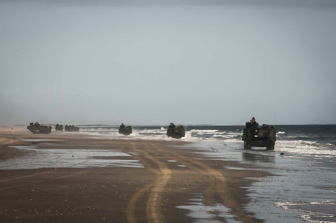 AAV-P7/A1 assault amphibious vehicle (AAV) with the AAV Platoon assigned to Fox Company, Battalion Landing Team, 2nd Battalion, 6th Marine Regiment, 26th Marine Expeditionary Unit (MEU), move towards a staging area on Onslow Beach, N.C., prior to conducting a night mechanized raid at Camp Lejeune, N.C., as part of Combined Composite Training Unit Exercise (COMPTUEX), Nov. 18, 2017. Combined COMPTUEX serves as the capstone event for the Amphibious Ready Group (ARG)/MEU team prior to deployment, fully integrating the ARG/MEU team as an amphibious force and testing their ability to execute missions across a range of military operations.