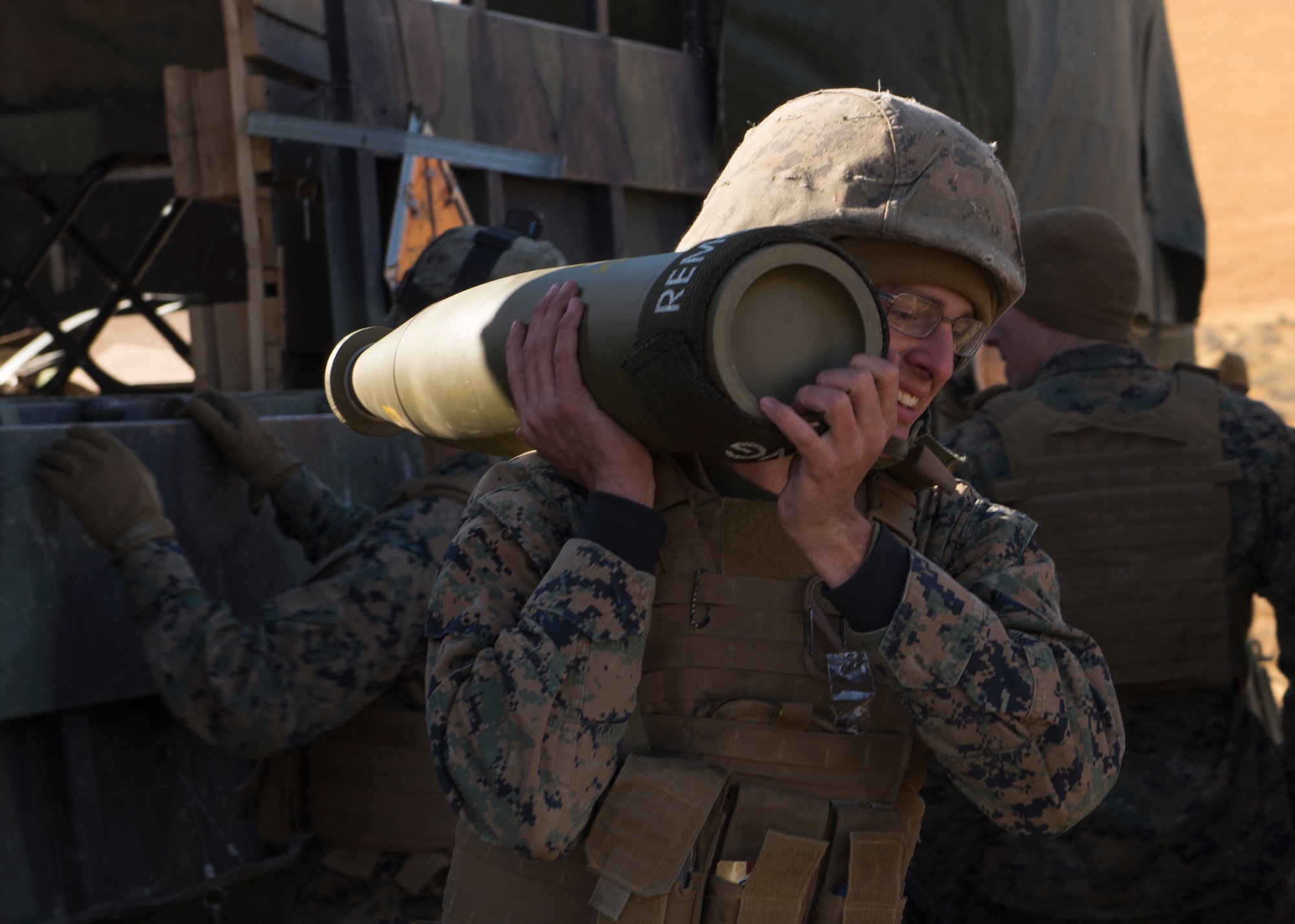 Marines from Battery P, 5th Battalion, 14th Marines, 4th Marine Division, U.S. Marine Forces Reserve, haul 155 mm projectiles for a M777A2 howitzer weapon system to separate gun emplacements during a live-fire training exercise at the Yakima Training Center, Washington, Oct 14, 2017. Using guided munitions, The M777 can fire accurately at a range of up to 25 miles away and may be accurate to within 11 yards of a target. (U.S. Air Force photo/Senior Airman Ryan Lackey)