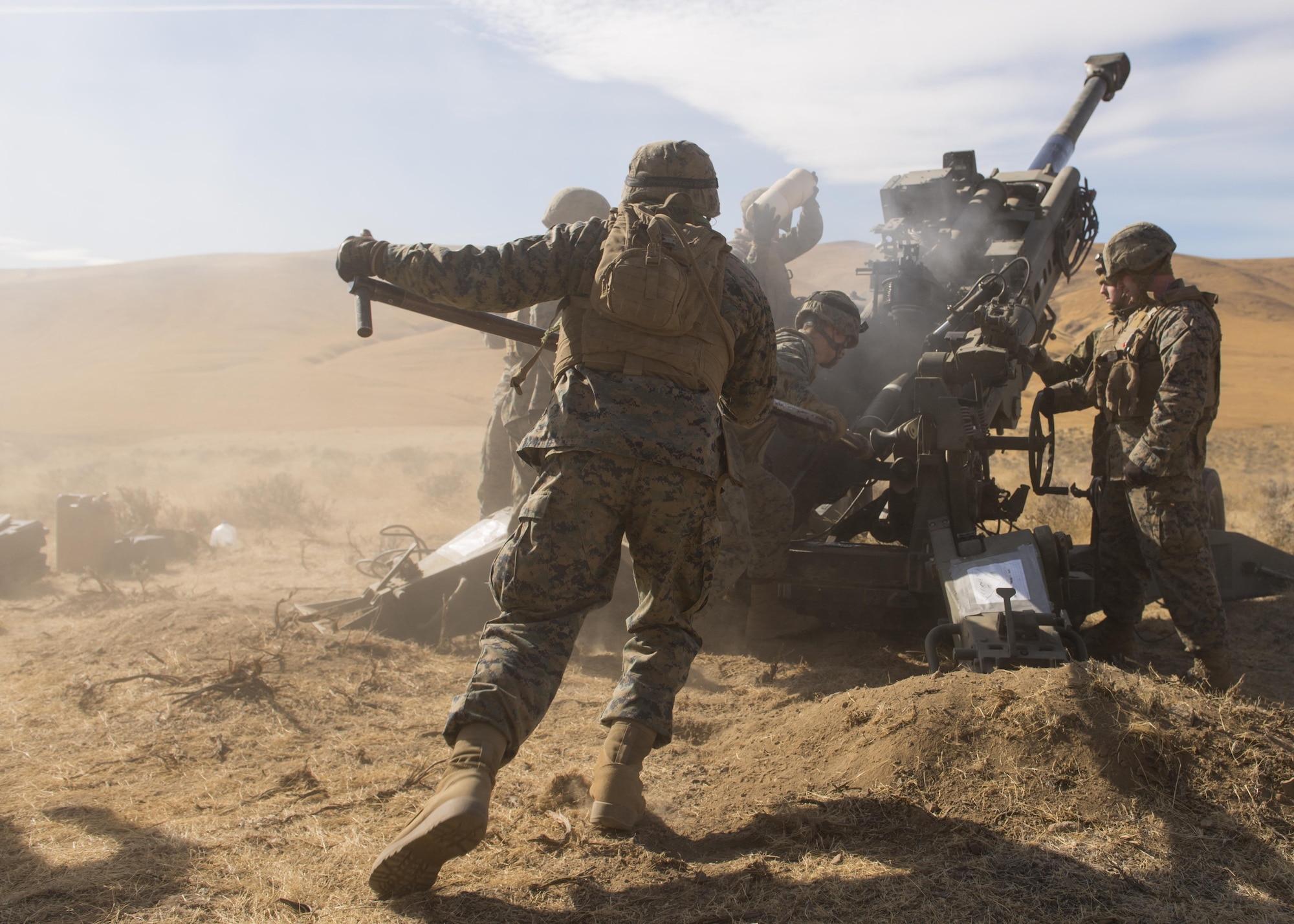 Marines of P Battery 5/14 use a ramming rod to push a 100-pound, high explosive projectile into the barrel of a M777A2 howitzer weapon system during a live-fire training exercise at the Yakima Training Center, Washington, Oct 14, 2017. In use by several armies by the mid-seventeenth century, the howitzer continues to be a staple of siege warfare to this day, allowing long-range, indirect fire on targets. (U.S. Air Force photo/Senior Airman Ryan Lackey)