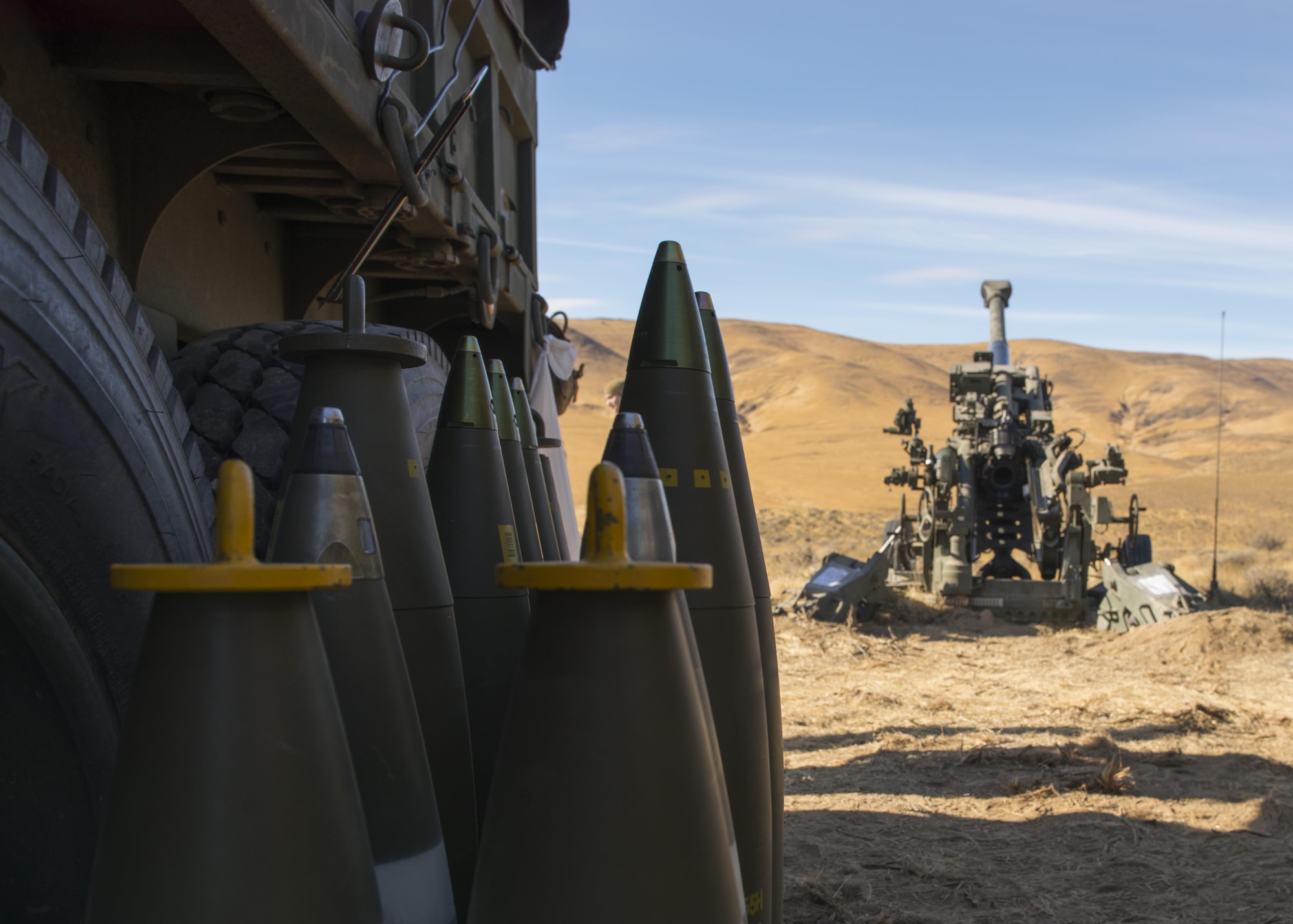 155 mm projectiles for a M777A2 howitzer sit beside their ammo truck during a live-fire U.S. Marine Corps training exercise at the Yakima Training Center, Washington, Oct 14, 2017. The M777 howitzer is a towed, lightweight artillery piece that succeeded the M198 howitzer in the USMC and U.S. Army in 2005. (U.S. Air Force photo/Senior Airman Ryan Lackey)