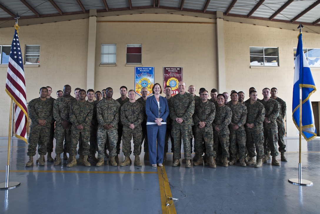 U.S. Marine Col. Michael V. Samarov, the commander of Special Purpose Marine Air-Ground Task Force - Southern Command, and Heide B. Fulton, the chargé d’ affaires with the U.S. Embassy in Honduras, pose for a photo with Marines during a closing ceremony at Soto Cano Air Base, Honduras, Nov. 8, 2017. The unit held a closing ceremony to wrap up their six-month deployment to Central America and to thank interagency and international partners for their support. The Marines and sailors of SPMAGTF-SC have completed a successful deployment in Central America and are scheduled to return to the United States in mid-November 2017.
