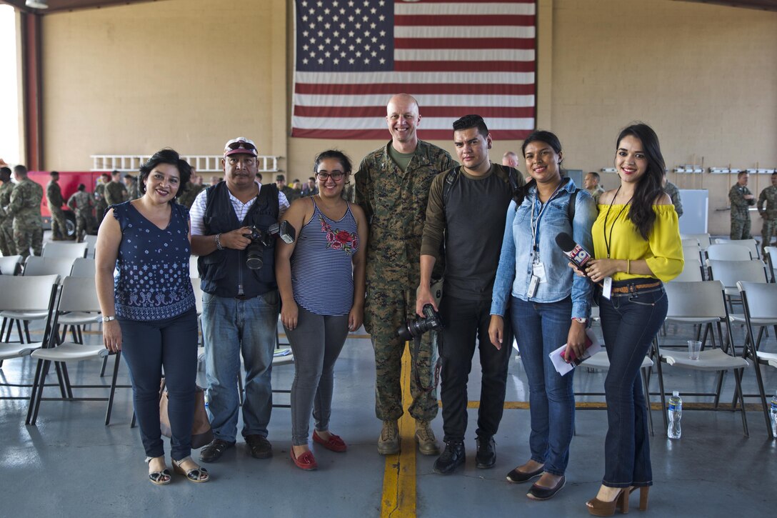U.S. Marine Col. Michael V. Samarov, the commander of Special Purpose Marine Air-Ground Task Force - Southern Command, poses for a photo with Honduran press members after a closing ceremony at Soto Cano Air Base, Honduras, Nov. 8, 2017. The unit held a closing ceremony to wrap up their six-month deployment to Central America and to thank interagency and international partners for their support. The Marines and sailors of SPMAGTF-SC have completed a successful deployment in Central America and are scheduled to return to the United States in mid-November 2017.