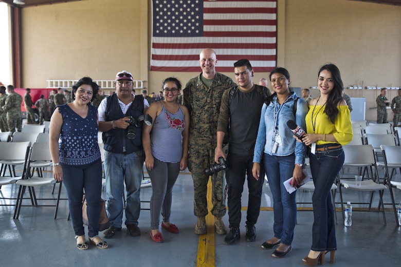 U.S. Marine Col. Michael V. Samarov, the commander of Special Purpose Marine Air-Ground Task Force - Southern Command, poses for a photo with Honduran press members after a closing ceremony at Soto Cano Air Base, Honduras, Nov. 8, 2017. The unit held a closing ceremony to wrap up their six-month deployment to Central America and to thank interagency and international partners for their support. The Marines and sailors of SPMAGTF-SC have completed a successful deployment in Central America and are scheduled to return to the United States in mid-November 2017.