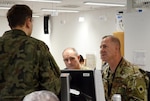 U.S. Army Brig. Gen. Jeffrey Smiley (RT), Commanding General of the 40th Infantry Division, California Army National Guard, discusses the situational battlefield during the daily command update brief during exercise Allied Spirit VII at the U.S. Army's Joint Multinational Readiness Center in Hohenfels, Germany Nov. 17, 2017.