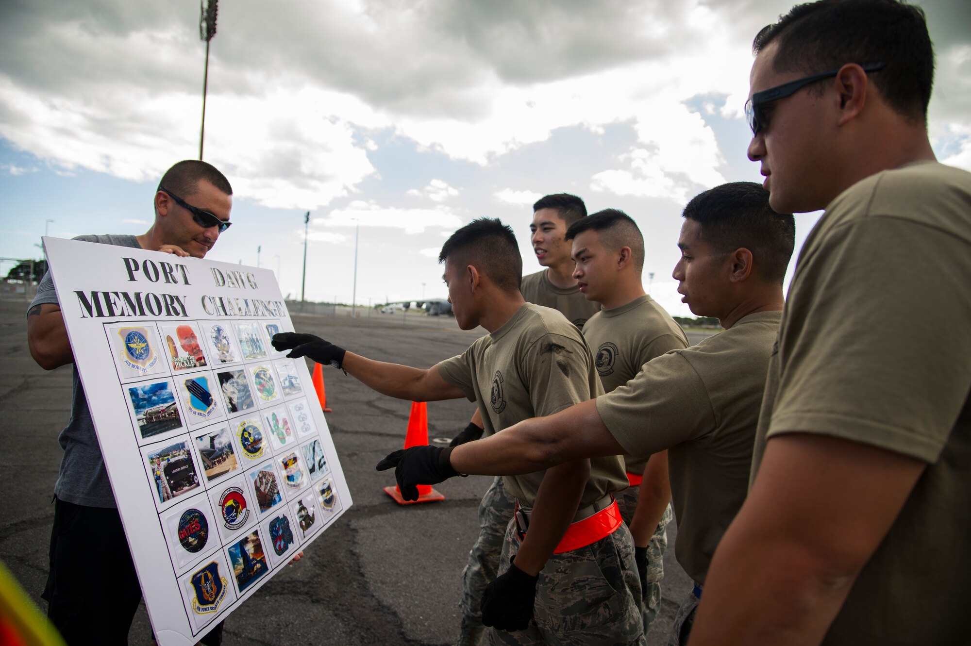 Members of the 48th Aerial Port Squadron review a memory board during the combat fitness challenge portion of the Hickam Port Dawg Challenge, at Joint Base Pearl Harbor-Hickam, Hawaii, Nov. 17, 2017. The aerial port community hosts a Port Dawg Challenge every year to promote professionalism, and demonstrate air and space expeditionary force capabilities. (U.S. Air Force photo by Tech. Sgt. Heather Redman)