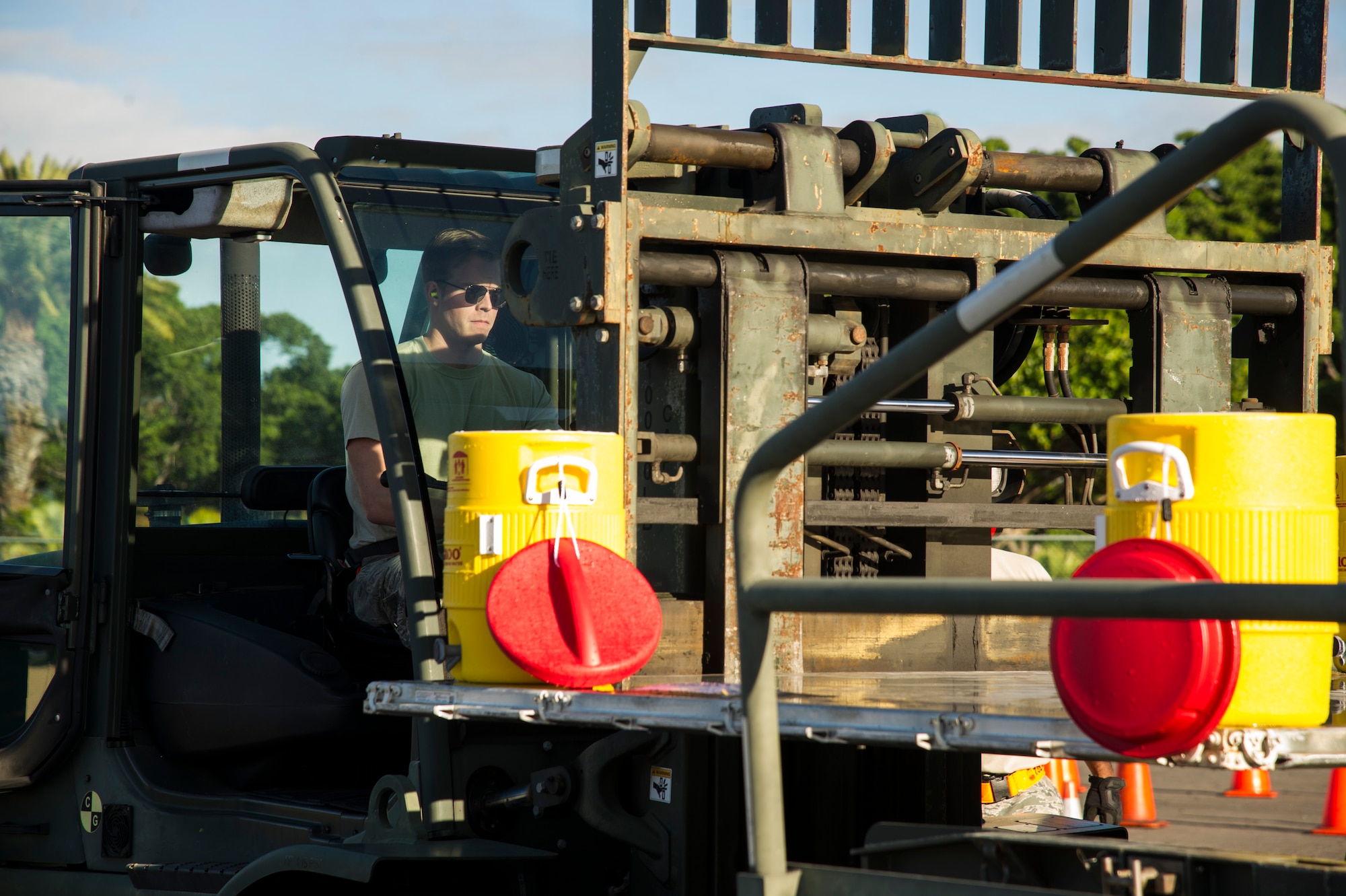 Senior Airman Ron Motz, 735th Air Mobility Squadron air freight journeyman, completes the second leg of the forklift obstacle during the Hickam Port Dawg Challenge, at Joint Base Pearl Harbor-Hickam, Hawaii, Nov. 17, 2017. The aerial port community hosts a Port Dawg Challenge every year to promote professionalism, and demonstrate air and space expeditionary force capabilities. (U.S. Air Force photo by Tech. Sgt. Heather Redman)