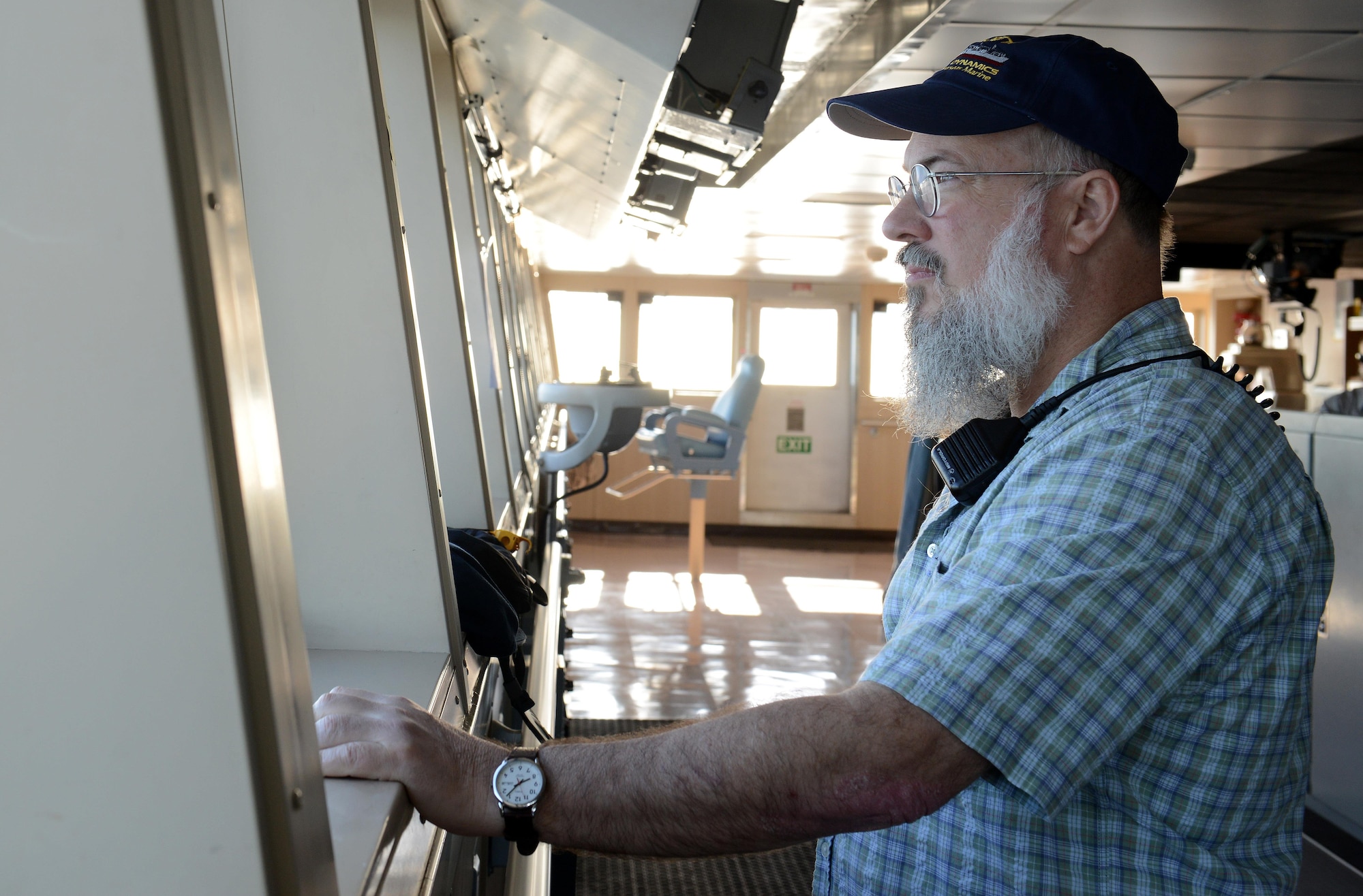 Alfred Murray, Military Sealift Command’s USNS Brittin captain, peers out over the bridge of the vessel upon arrival to Port of Ponce, Puerto Rico, Nov. 3, 2017.