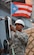 U.S. Army Staff Sgt. Eliezer Casas, 690th Rapid Port Opening Element, 832nd Transportation Battalion, 597th Trans. Brigade distribution yard NCO in charge, fixes a Puerto Rico flag on a vehicle at Port of Ponce, Puerto Rico, Nov. 7, 2017.