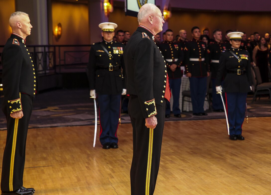 Lieutenant Gen. James B. Laster, director, Marine Corps Staff, and guest of honor, renders honors as the traditional birthday cake is marched out to the official party during Marine Barracks Washington’s Birthday Ball celebration  at the Washington Hilton, Washington D.C., Nov. 18, 2017. Each year, the Barracks holds a ball to honor and celebrate the Marine Corps’ birthday by reflecting on its rich traditions through the reading of Gen. John A. Lejeune’s Birthday Message and the cutting of the traditional birthday cake. (Official Marine Corps photo by Cpl. Damon Mclean/Released)