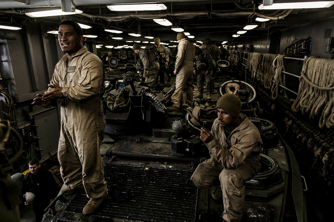 U.S. Marines with Fox Company, Battalion Landing Team, 2nd Battalion, 6th Marine Regiment, 26th Marine Expeditionary Unit (MEU), exit AAV-P7/A1 assault amphibious vehicles (AAV) at the well deck of the dock landing ship USS Oak Hill (LSD 51) after returning from a night mechanized raid at Camp Lejeune, N.C., during Combined Composite Training Unit Exercise, Nov. 20, 2017. Combined COMPTUEX serves as the capstone event for the Amphibious Ready Group-MEU team prior to a deployment, fully integrating the ARG-MEU team as an amphibious force and testing their ability to execute missions across a range of military operations. (U.S. Marine Corps photo by Staff Sgt. Dengrier M. Baez)