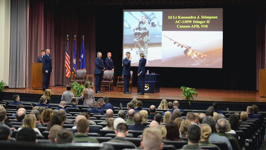 The 14th Flying Training Wing leadership and Brig. Gen. David W. Hicks award members of Specialized Undergraduate Pilot Training Class 18-02 with their coveted Air Force pilot wings Nov. 17, 2017, on Columbus Air Force Base, Mississippi. Almost every three weeks a graduation ceremony takes place marking the end of pilot training for student pilots and the beginning of their career alongside some of the greatest aviators in the world. Hicks is the Director of Strategy, Concepts, and Assessments, Deputy Chief of Staff for Strategic Plans and Requirements, Headquarters U.S. Air Force in Washington, D.C. (U.S. Air Force photo by Airman 1st Class Keith Holcomb)