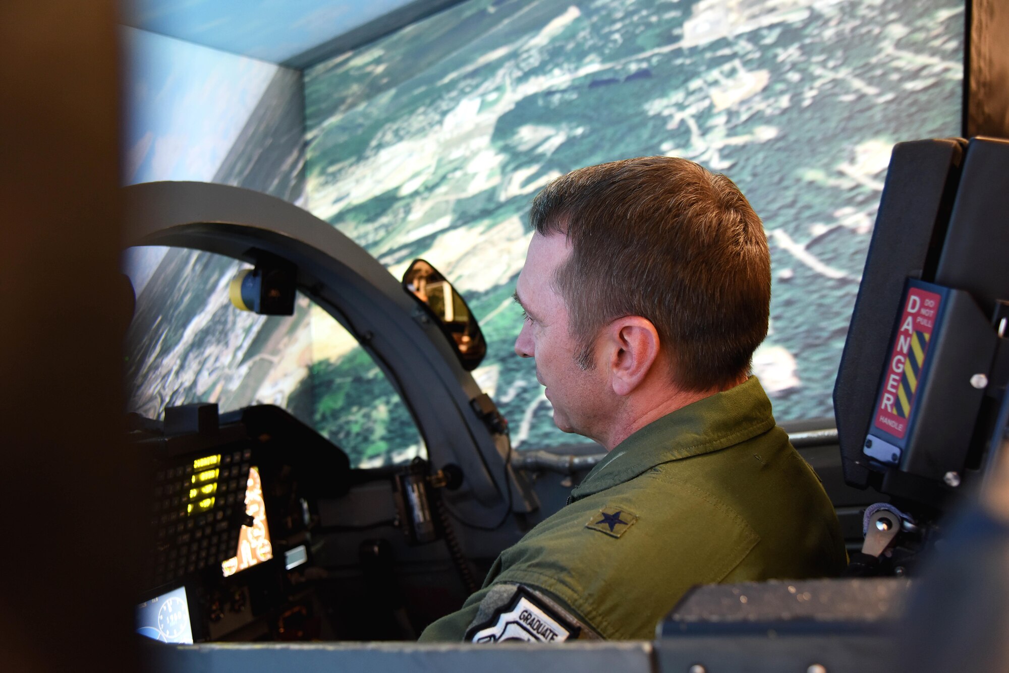 Brig. Gen. David Hicks, the Director of Strategy, Concepts, and Assessments, Deputy Chief of Staff for Strategic Plans and Requirements, Headquarters U.S. Air Force in Washington, D.C., flies in a T-38C Talon flight simulator, Nov. 17, 2017, on Columbus Air Force Base, Mississippi. Hicks spoke at Specialized Undergraduate Pilot Training Class 18-02’s graduation ceremony and took the rest of the day to learn about Columbus AFB and see the changes in pilot training since his time at Columbus AFB 27 years ago. (U.S. Air Force photo by Melissa Dublin)