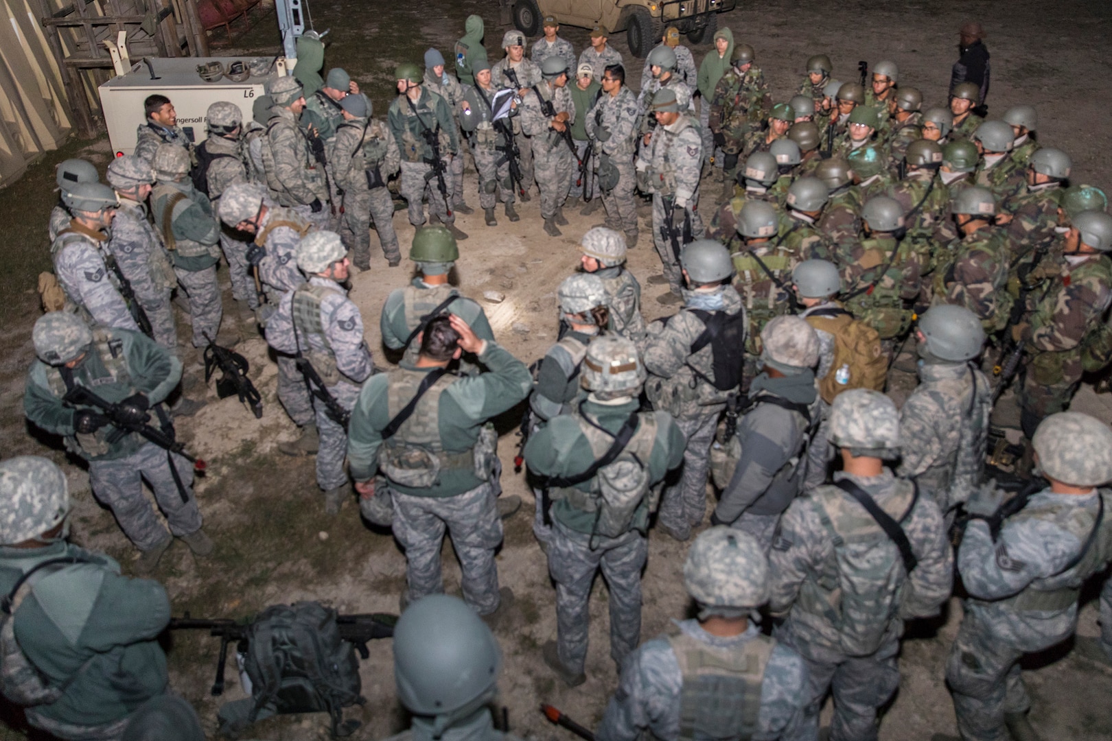 Students from the Inter-American Air Force Academy’s 837th Training Squadron and 343rd TRS attend a pre-mission briefing at Joint Base San Antonio-Camp Bullis as part of their final training exercise Nov. 8, 2017. The students practiced reconnaissance, ambush, searching, and patrolling tactics. This was the first time the 837th TRS and 343rd TRS partnered for joint training.