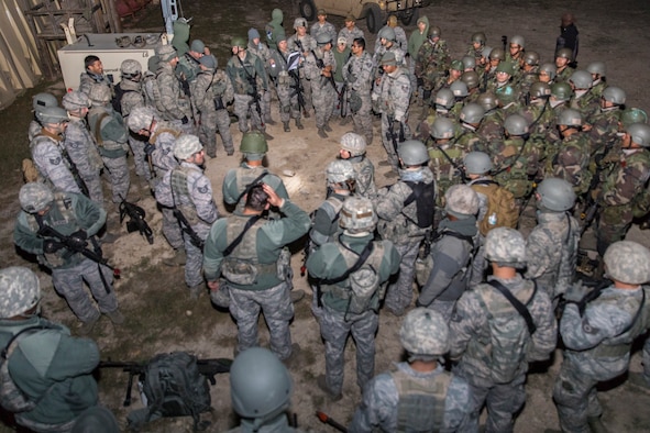 Students from the Inter-American Air Force Academy’s 837th Training Squadron and 343rd TRS attend a pre-mission briefing at Joint Base San Antonio-Camp Bullis as part of their final training exercise Nov. 8, 2017. The students practiced reconnaissance, ambush, searching, and patrolling tactics. This was the first time the 837th TRS and 343rd TRS partnered for joint training.