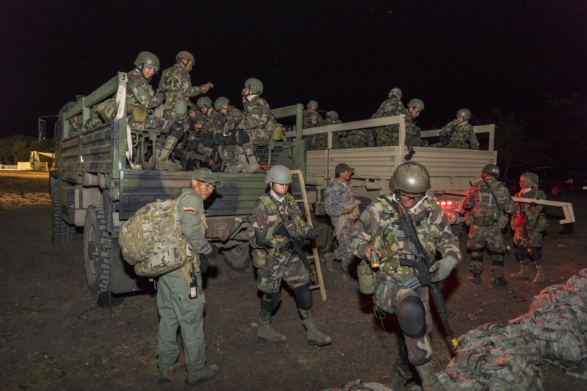 Students from the Inter-American Air Force Academy’s 837th Training Squadron load onto a military vehicle at Joint Base San Antonio-Camp Bullis as part of their final training exercise Nov. 8, 2017. The students practiced reconnaissance, ambush, searching, and patrolling tactics. This was the first time the 837th TRS and 343rd TRS partnered for joint training.