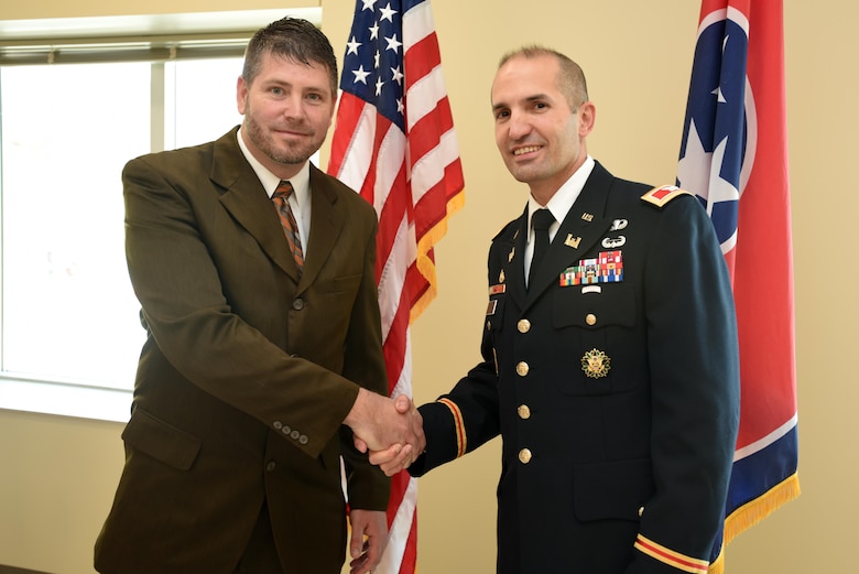 Col. Paul Kremer, U.S. Army Corps of Engineers Great Lakes and Ohio River Division acting commander, recognizes Jason Phillips, project engineer and contracting officer’s representative, for his work in support of the new Construction Support Building at the Y-12 National Security Complex in Oak Ridge, Tenn. The presentation took place at the building’s ribbon cutting ceremony Nov. 20, 2017. Phillips worked tirelessly with the various stakeholders to ensure delivery of a quality project. (USACE Photo by Lee Roberts)