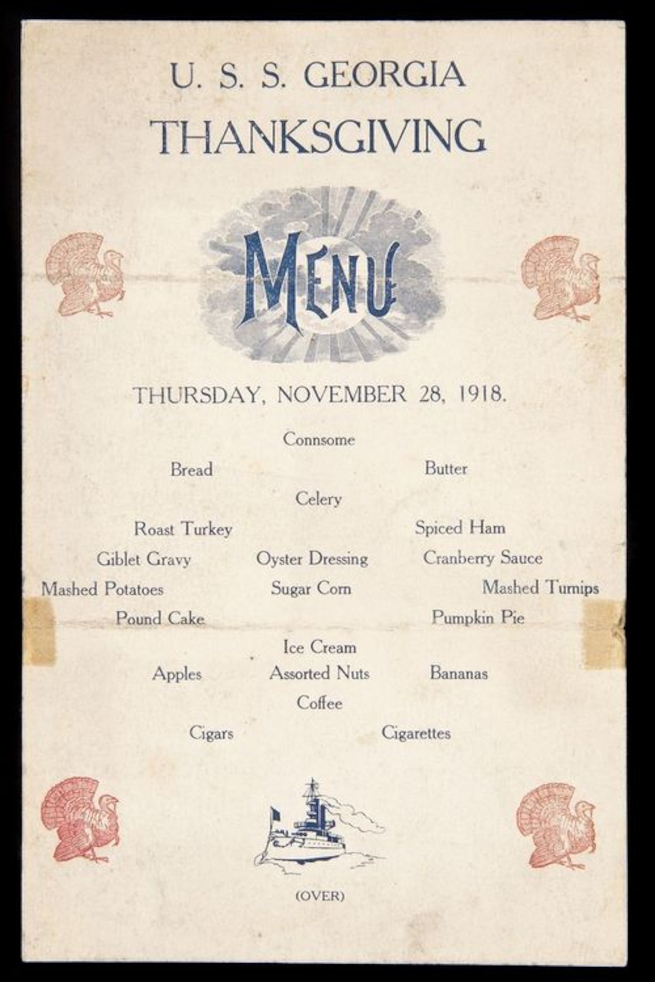 Brown menu with Turkeys printed on it, and food items such as mashed potatoes, roast turkey, giblet gravy, and cigars and cigarettes, and dated Thursday, November 28, 1918.
