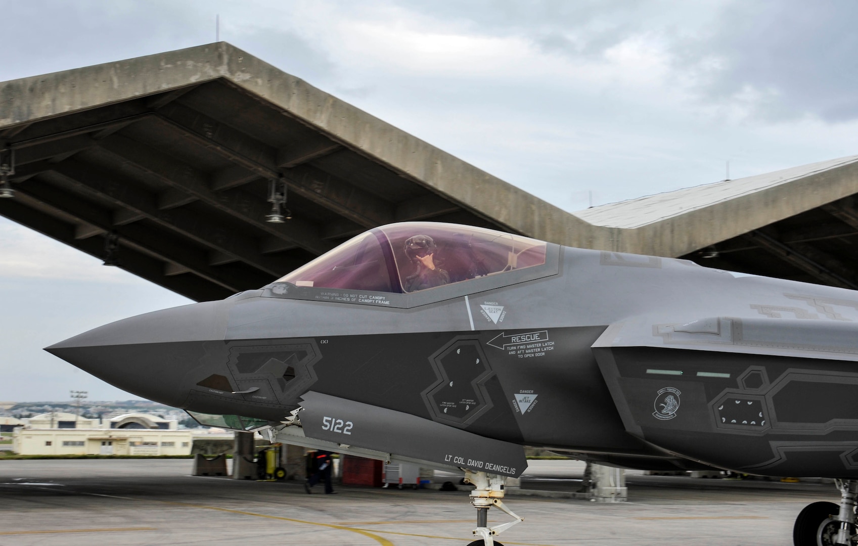 U.S. Air Force Lt. Col. Michael Albrecht, 388th Operations Support Squadron F-35A Lightning II pilot, gestures to personal before take-off at Kadena Air Base, Japan, Nov. 16, 2017. Twelve F-35A stealth fighters from Hill Air Force Base, Utah's 388th and 419th Fighter Wings deployed to Kadena AB to demonstrate the continuing U.S. commitment to stability and security in the region.