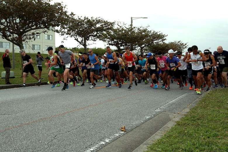 Runners take off at the start of the 28th Annual Kinser Half Marathon Nov. 19 aboard Camp Kinser, Okinawa, Japan. The run was open to participants island wide. The 13.1-mile run brought the military and local communities together for a friendly competition. After the race, runners celebrated their accomplishments with delicious food and drinks.