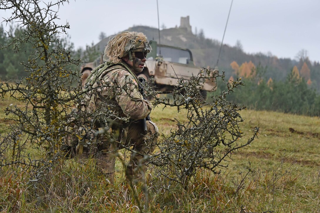 U.S. Army Staff Sgt. Marcin Szewczyk assigned to the 1st Squadron, 2nd Cavalry Regiment overlooks the terrain during Exercise Allied Spirit VII on the 7th Army Training Command’s Hohenfels Training Area, Germany.
