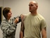 Maj. Amelia Morgan, 445th Aerospace Medicine Squadron, gives a flu vaccination to Master Sgt. Brandon Ashcraft, 445th Civil Engineer Squadron, during the Nov. 5 unit training assembly.