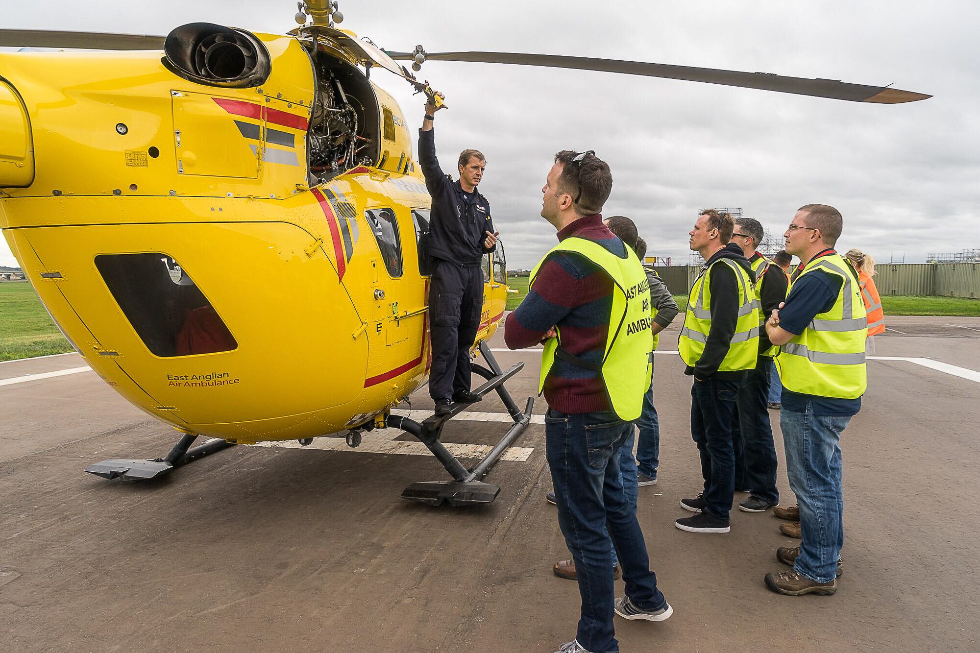 Pilot Matt Sandbach, with the East Anglian Air Ambulance, answers questions and discusses the inner workings of an Airbus H145's power-plant engines with maintainers from the 352d Special Operations Maintenance Squadron, 352d Special Operations Wing. The H145 is capable of cruising at 158 mph to respond to regional emergencies. The 352 SOMXS visit was a part of the Honorary Commander Program, which provides a unique opportunity for local area community members to shadow 352 SOW leaders to encourage an exchange of ideas, share experiences and foster a supportive relationship with the community.