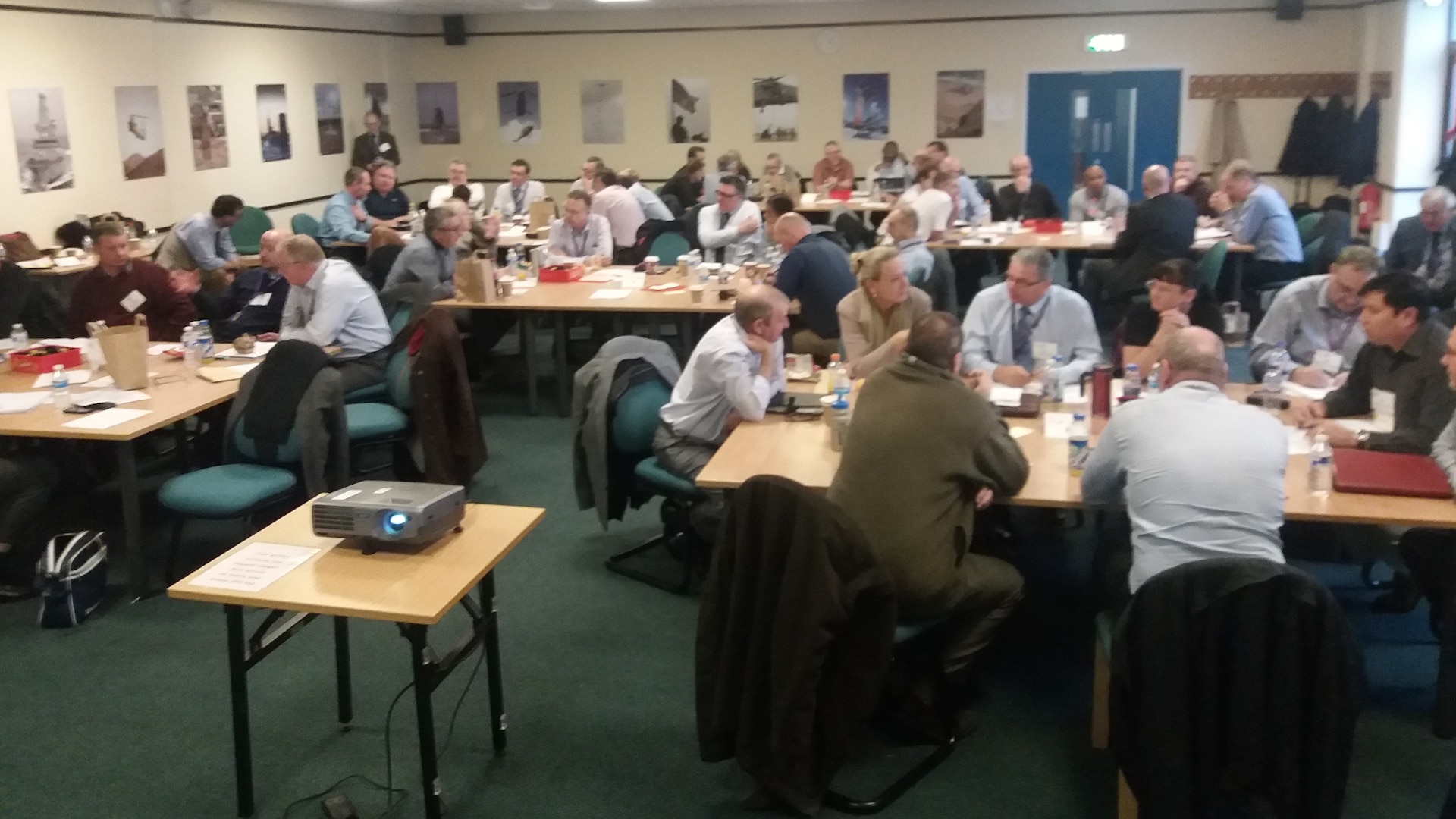 Quality assurance members from DCMA United Kingdom and others collaborate during a partner nation event.