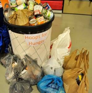 A Hoops for Hunger donation basket overflows with donated canned foods in Sam’s Fitness Center at Joint Base Charleston – Weapons Station, S.C., Nov. 16, 2017.