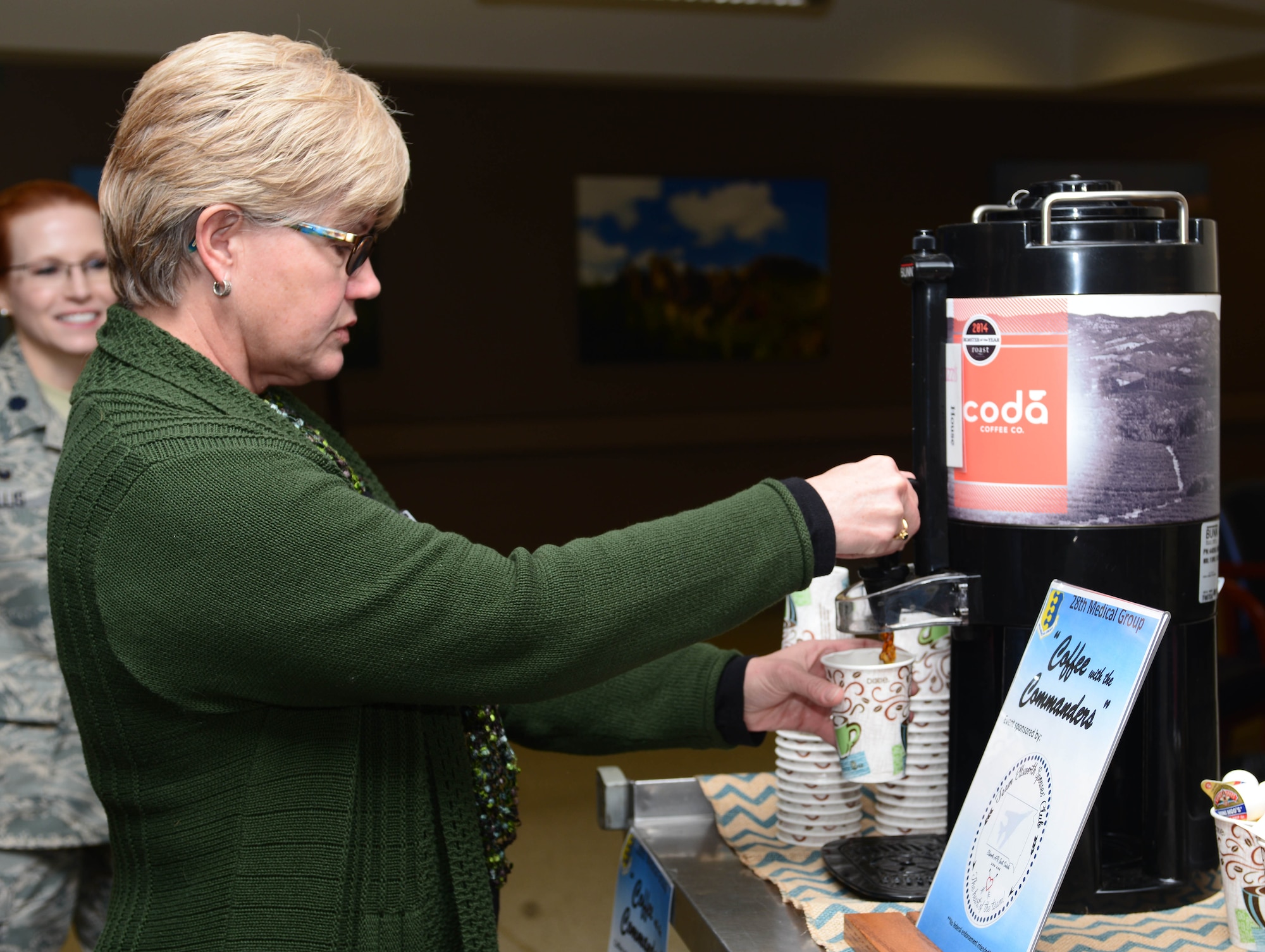 Helen Romeyn, a family advocacy nurse assigned to the 28th Medical Group, fills a cup of coffee during the 28th MDG’s “Coffee with the Commanders” event at Ellsworth Air Force Base, S.D., Nov. 20, 2017. The 28th MDG held the event to offer patients and staff a free cup of coffee and an opportunity to connect with medical group leaders. (U.S. Air Force photo by Airman 1st Class Donald C. Knechtel)