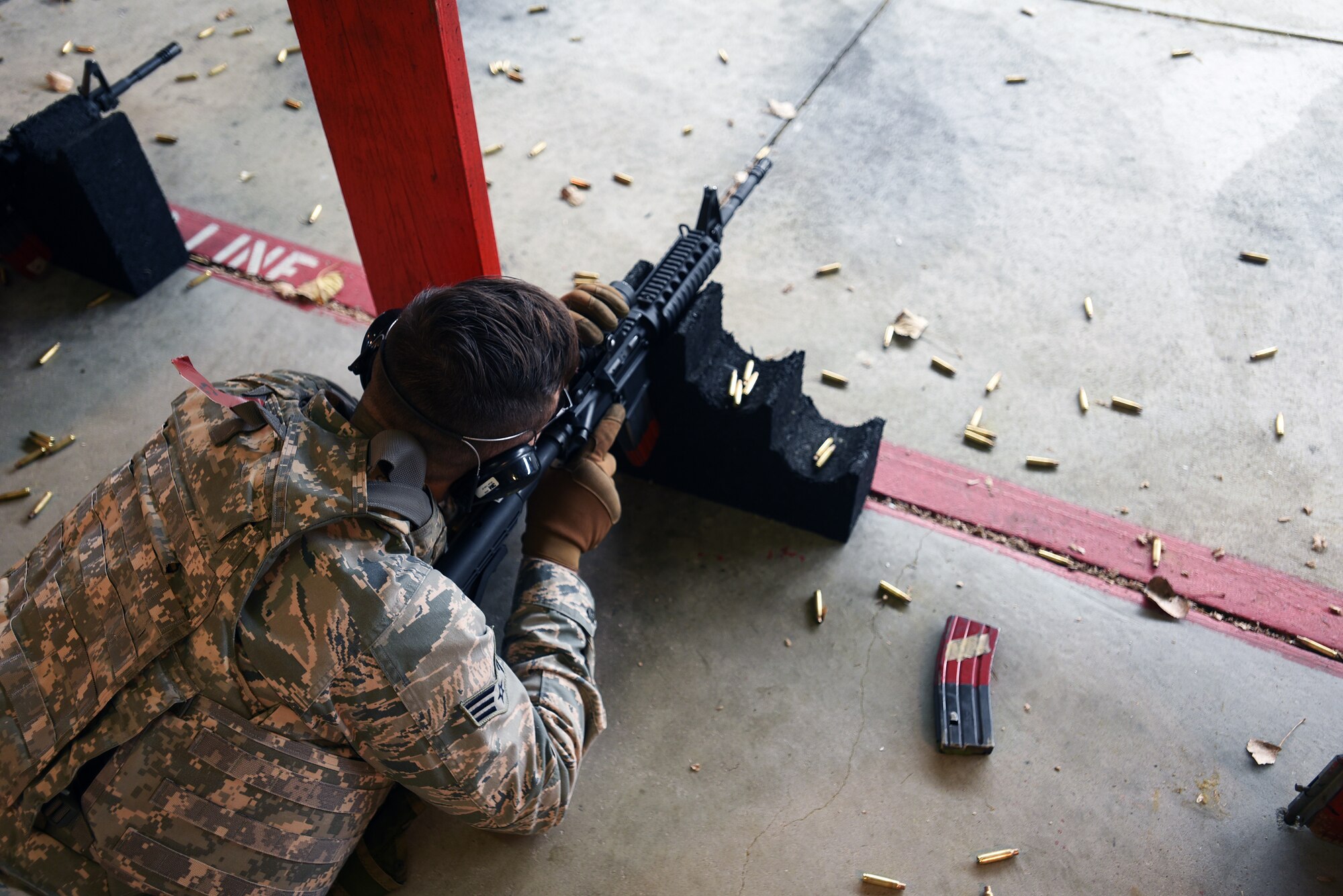 Senior Airman Dylan Spencer, 22nd Aircraft Maintenance Squadron aerospace maintenance journeyman, shoots an M4 Carbine Nov. 20, 2017, at McConnell Air Force Base, Kansas. When qualifying on a weapon, Airmen practice in prone, kneeling and standing stances. (U.S. Air Force photo by Airman Michaela R. Slanchik)