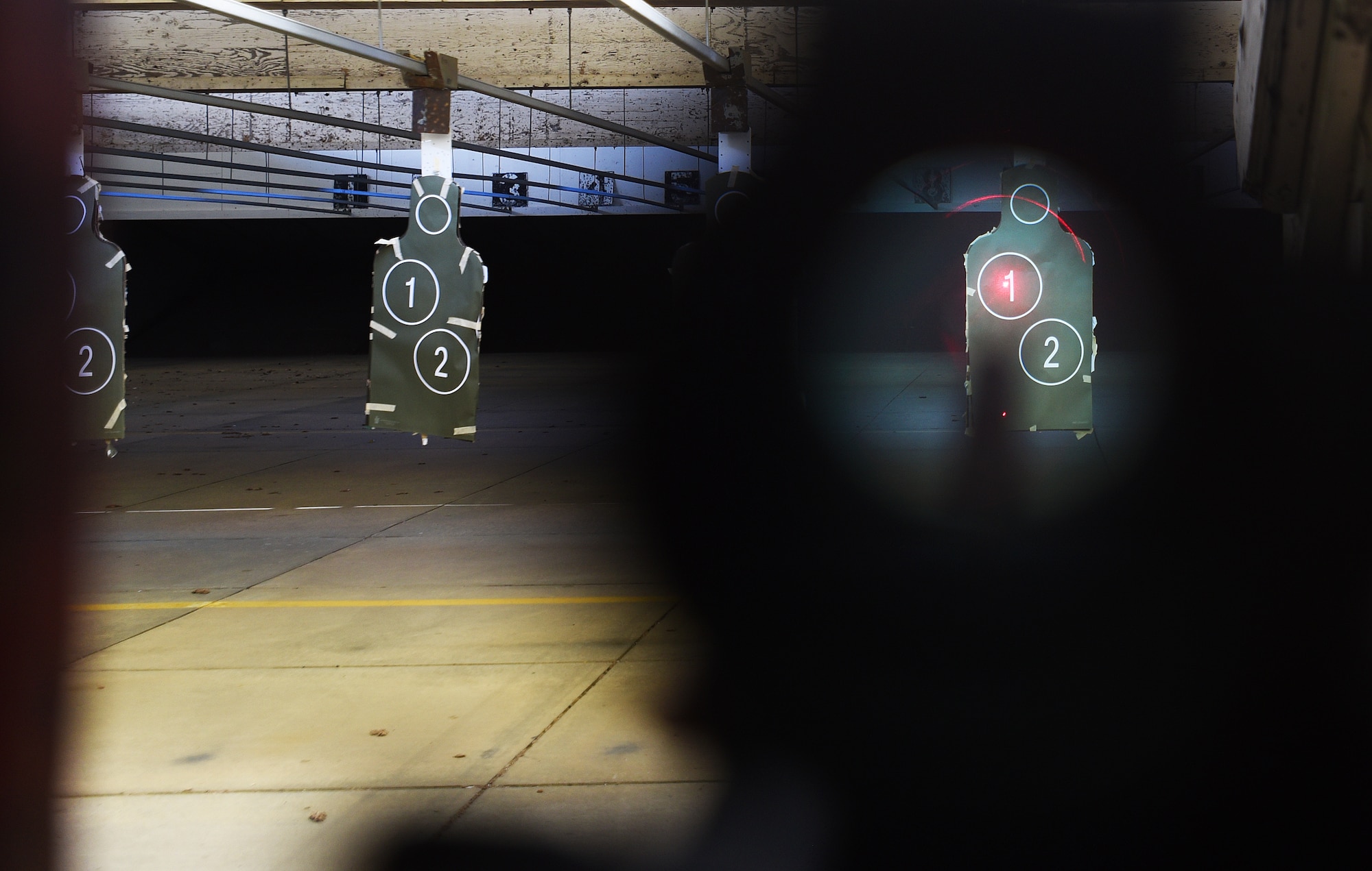McConnell Airmen use an M68 close combat optic to assist them in shooting an M4 Carbine Nov. 20, 2017, at McConnell Air Force Base, Kansas. Airmen qualify on their weapons before going on deployments, certain permanent changes of station and annually for those who carry on a daily basis. (U.S. Air Force photo by Airman Michaela R. Slanchik)